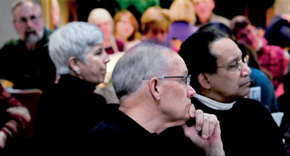 REMEMBRANCE: The Senior Spectrum Muskie Center in Waterville was filled with people for the annual Martin Luther King Jr. community breakfast on Monday. Listening from left are Sally Harwood, Bud Vassey and David Deas. “We see people here we may see only once a year,” Deas said. “We talk about peace and civil rights.”