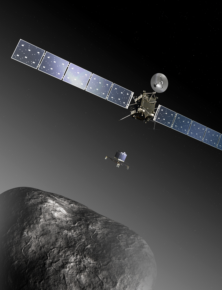 This image provided by the European Space Agency ESA shows an artist’s impression of the Rosetta orbiter deploying the Philae lander to comet 67P/ChuryumovñGerasimenko. The image is not to scale; the Rosetta spacecraft measures 104 feet across including the solar arrays, while the comet nucleus is thought to be about 2.5 miles wide. Scientists at the European Space Agency are expecting their comet-chasing orbiter to wake from almost three years of hibernation on Monday and phone home to say all is well.
