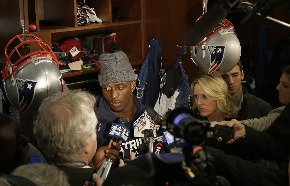 New England Patriots free safety Devin McCourty listens to a reporter's question while standing in front of his locker during a media availability at the NFL football team's facility in Foxborough, Mass., Monday, Jan. 20, 2014. The Patriots lost to the Denver Broncos in the AFC Championship game Sunday in Denver ending their season. (AP Photo/Stephan Savoia)