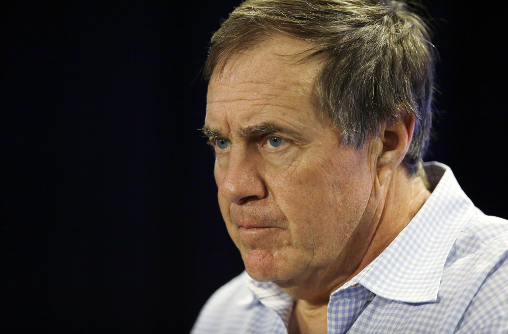 New England Patriots head coach Bill Belichick listens to a reporter’s question during a news conference in Foxborough, Mass., on Monday, Jan. 20, 2014.