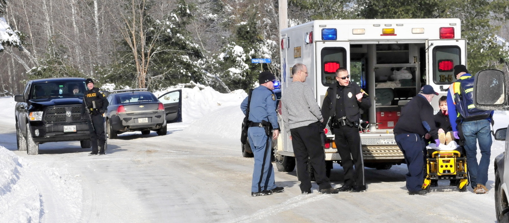 SELF INFLICTED: Edward Domasinsky is loaded into an ambulance with injuries to his face that police say was self inflicted following a domestic dispute with a woman at a residence on the Horseback Road in Clinton on Sunday, Jan. 5, 2014.