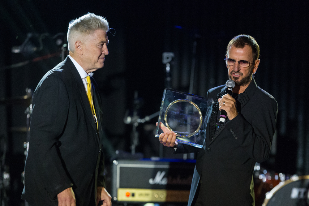 Director David Lynch, left, presents musician Ringo Starr with the ìLifetime of Peace & Love Awardî on stage during the David Lynch Foundation Honors Ringo Star “A Lifetime of Peace & Love” event held at the El Rey Theatre on Monday in Los Angeles.