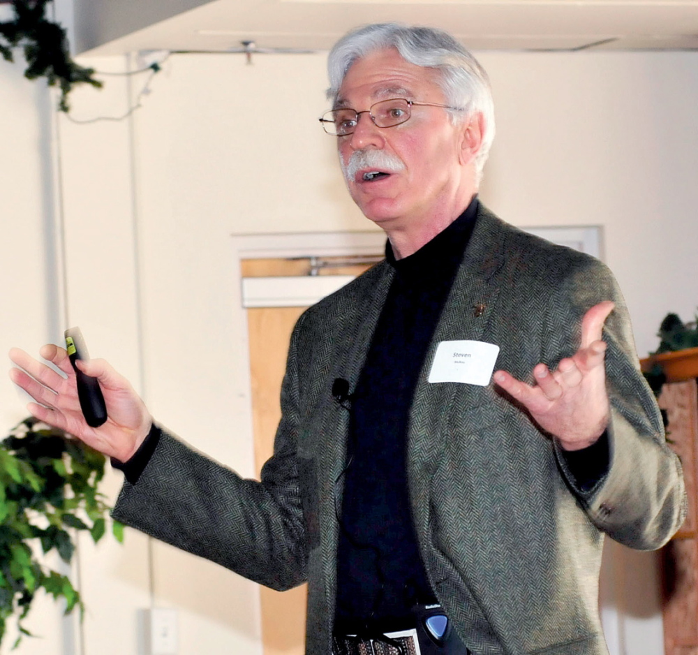 CHANGES COMING: Steven Mulkey, president of Unity College, speaks about environmental reform during a Mid-Maine Global Forum event in Waterville on Wednesday.