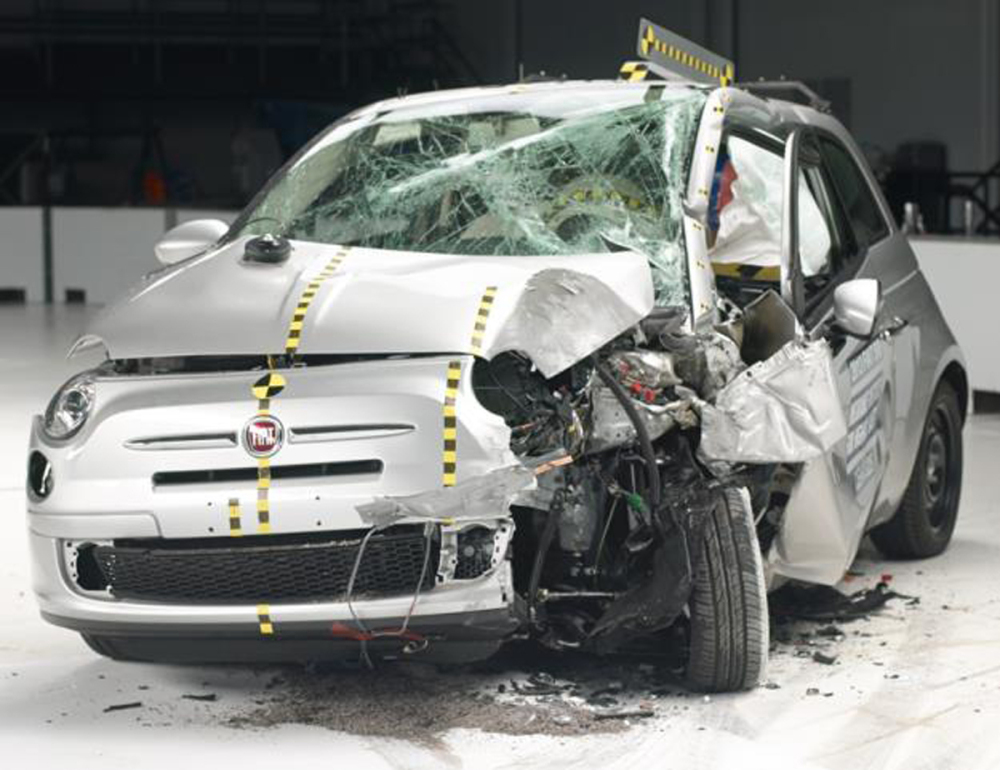 The crash force of the IIHS test ripped the door hinges off the Fiat 500, causing the doors to fall open.