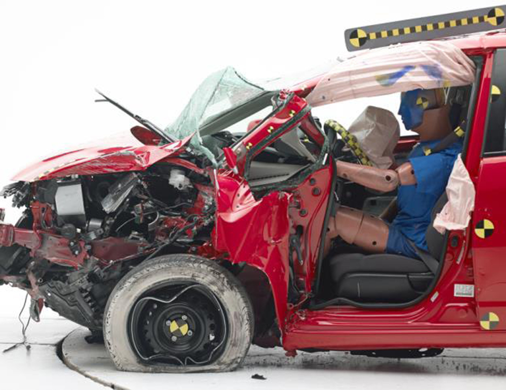 The Honda Fit's steering column was pushed so far into the vehicle in the crash test that the dummy’s head slid off the air bag and hit the instrument panel.