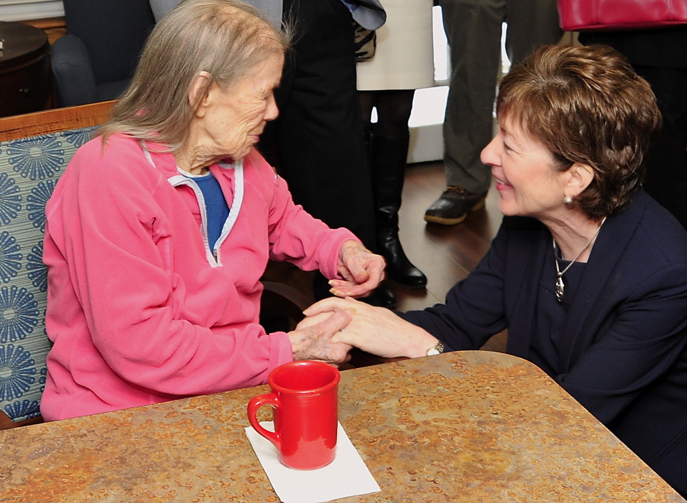 Sen. Susan Collins meets Margaret Randall, 102, a resident of Bay Square in Yarmouth, on Wednesday. Collins praised the retirement home’s innovative Alzheimer’s treatment.