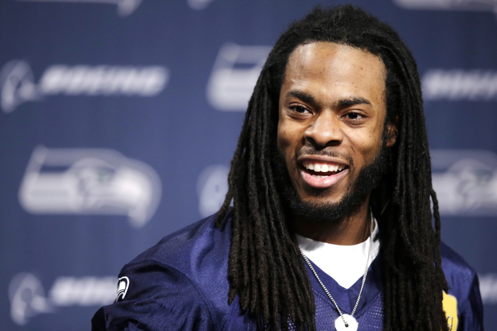 Seattle Seahawks' Richard Sherman speaks at an NFL football news conference Wednesday, Jan. 22, 2014, in Renton, Wash. The Seahawks play the Denver Broncos in the Super Bowl on Feb. 2. (AP Photo/Elaine Thompson)