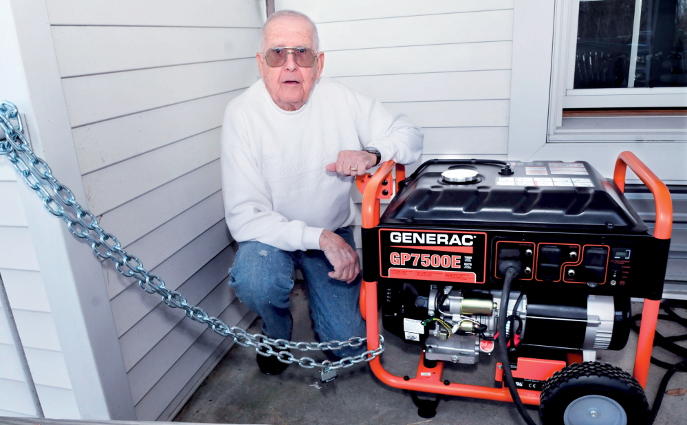 SECURE: Dick Thorndike, manager of the Hartland Manor, beside a new generator that is chained to the building on Thursday, Jan. 23, 2014, after it was discovered that thieves stole their previous generator last weekend.