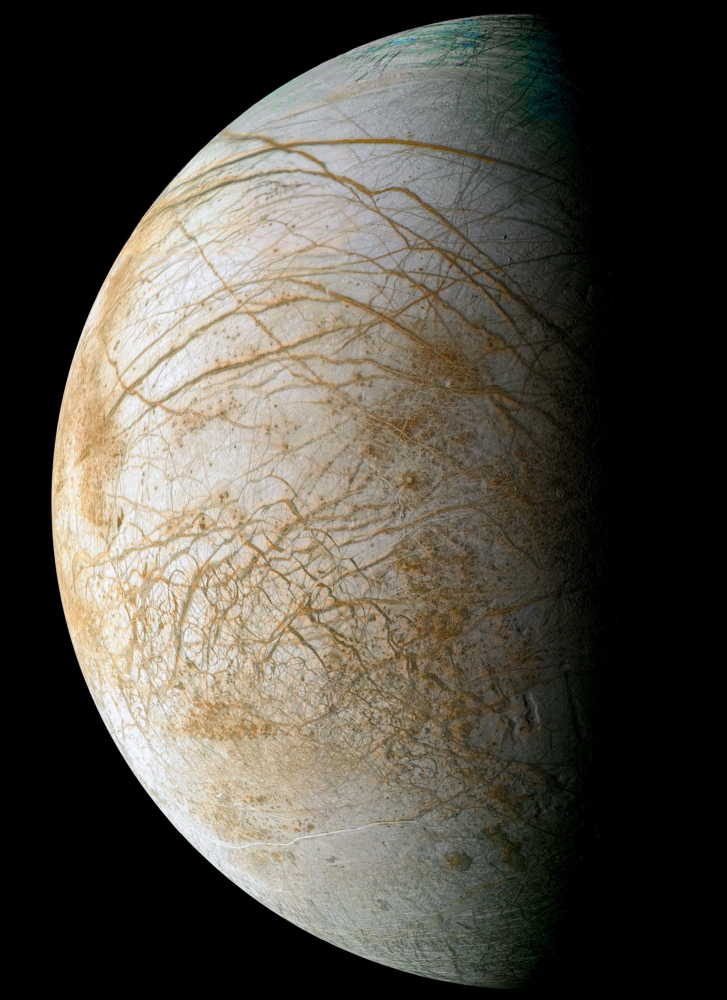 THICK ICE: Jupiter’s moon Europa is covered in ice 50 to 100 miles thick. This view from the Galileo spacecraft combines images taken in 1998 and 1995.