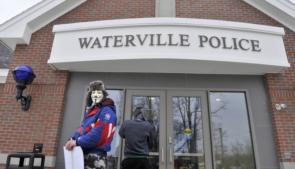 Mark Leighton of Gardiner wears a mask as he takes part in an event urging criminal charges in the Ayla Reynolds case.