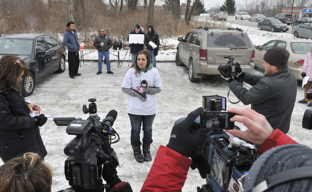 speaking out: Trista Reynolds, mother of missing toddler Ayla, speaks to the news media Saturday outside the Waterville police station during a Push for Prosecution protest.