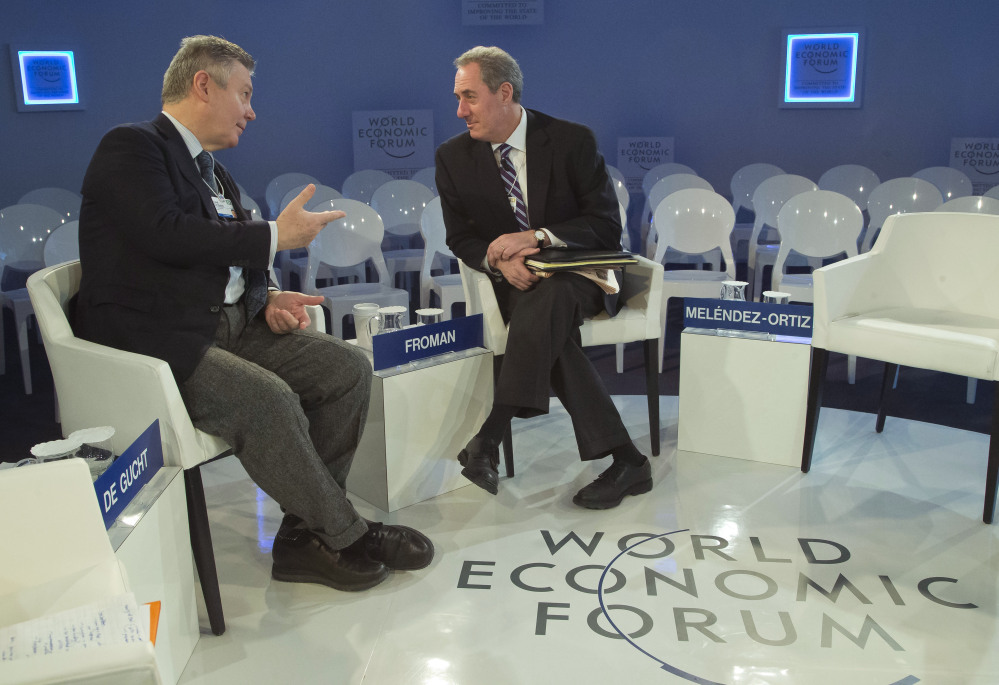 EU Trade Commissioner Karel De Gucht, left, gestures as he speaks with U.S. Trade Representative Michael Froman, before a session at the World Economic Forum in Davos, Switzerland on Saturday.