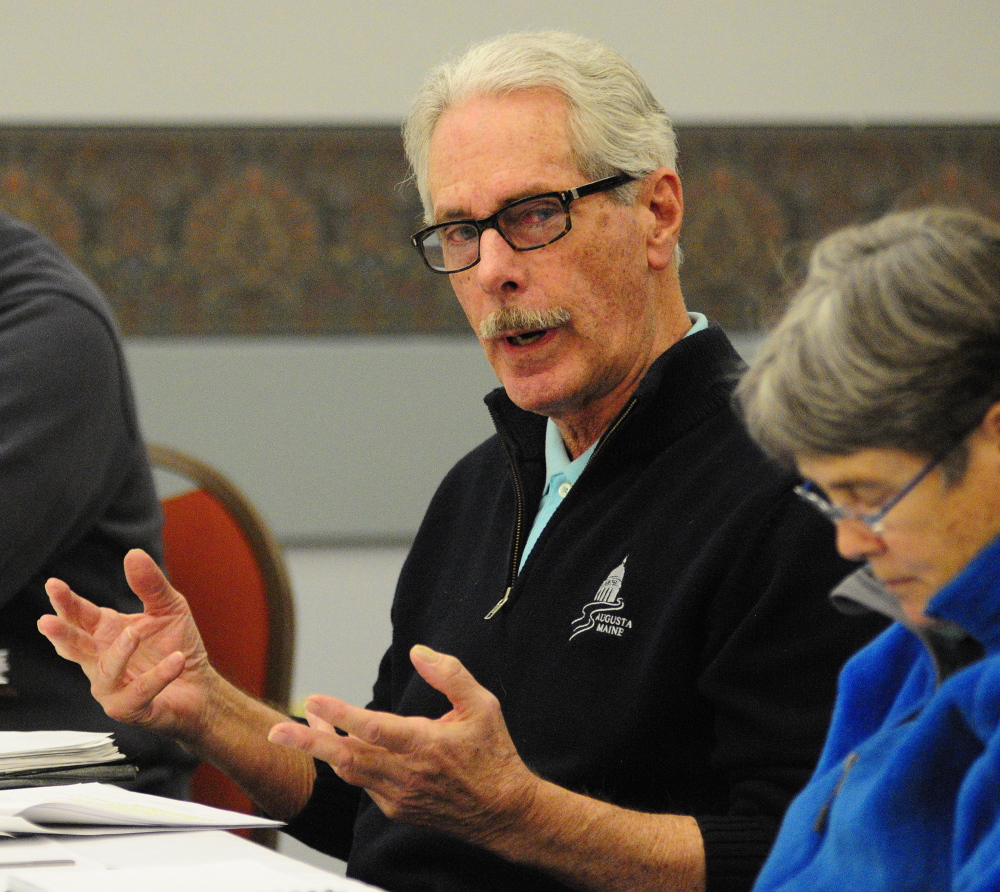 LOOKING AHEAD: Councilors Cecil Munson, left, speaks during the Augusta City Council goal-setting meeting Saturday in the Augusta Civic Center. Councilor Dale McCormick is at right.