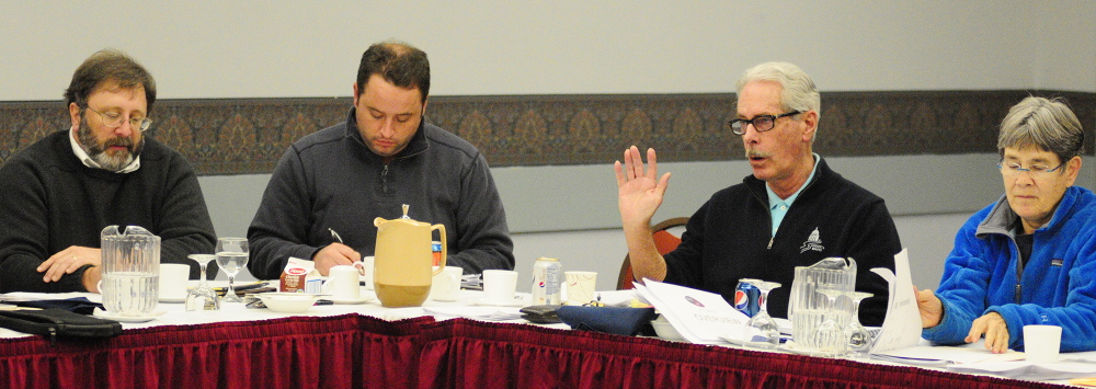 WHAT THE FUTURE HOLDS: Cecil Munson, second from right, speaks as fellow City Councilors Mark O’Brien, far left, Darek Grant, and Dale McCormick, far right, listen during a goal-setting meeting on Saturday in the Augusta Civic Center.