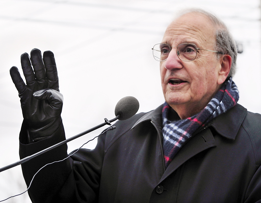 Former Sen. George Mitchell attends a Red Sox rally on Saturday at Hadlock Field, where Boston’s three World Series trophies were on display.