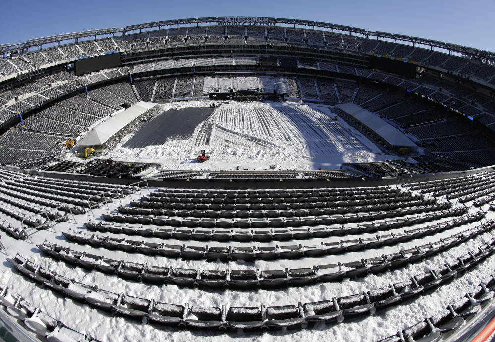 Snow is accumulated on the seats and on the field of MetLife Stadium as crews removed snow ahead of Super Bowl XLVIII following a snow storm last Wednesday. Super Bowl XLVIII, which will be played between the Denver Broncos and the Seattle Seahawks on Feb. 2, will be the first Super Bowl held outdoors in a city where it snows.