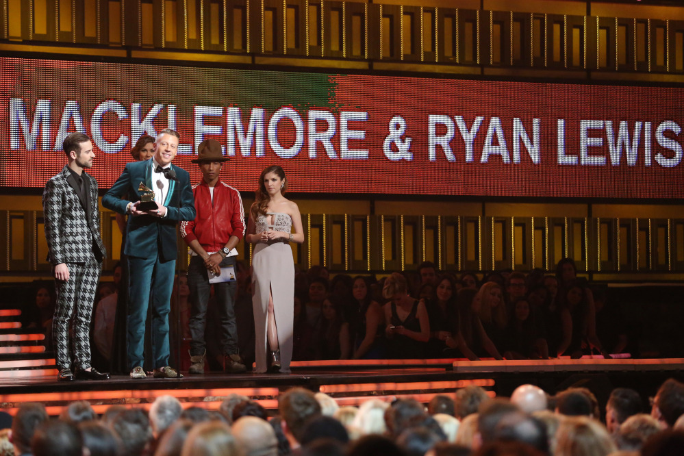 Ryan Lewis, left, and Macklemore, second left, accept the award for best new artist from presenters Anna Kendrick, right and Pharrell Williams at the 56th annual Grammy Awards at Staples Center on Sunday.