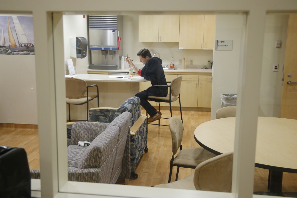 Daniel Bennett, who is taking part in research for a better flu vaccine, sits in isolation as he remains quarantined after having live flu virus sprayed into his nose at the National Institute of Health in Bethesda, Md. Bennett’s flu was pretty mild, and he was able to pass the time studying, watching TV and playing games with the four other study participants infected this month.