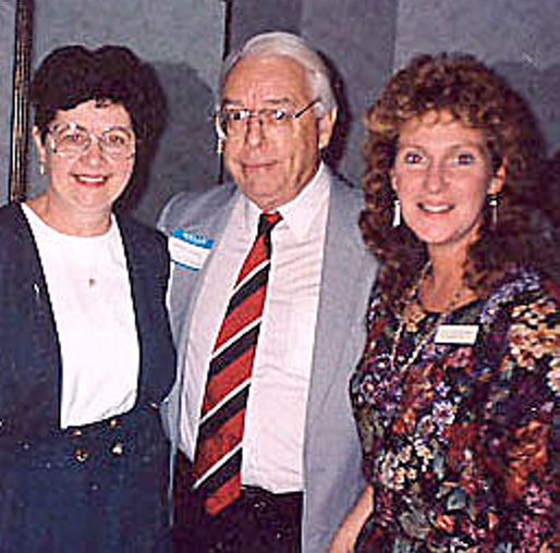 TOGETHER: Walter Simcock is surrounded by former Mid-Maine Chamber of Commerce employees Audrey Harding, left, and Jill Van Gorden.