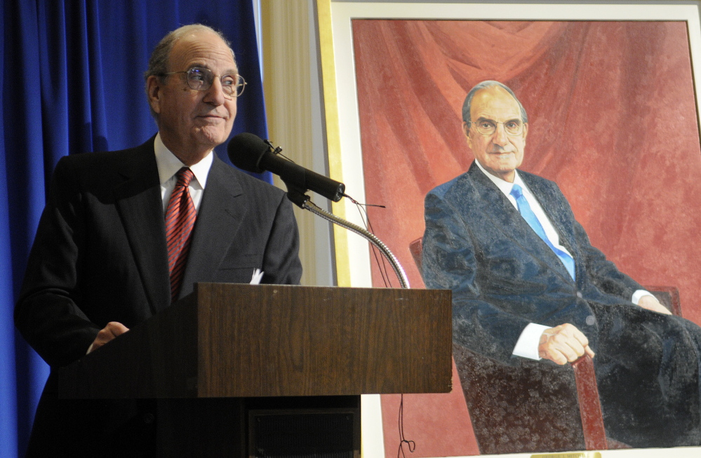Staff photo by Andy Molloy ON DISPLAY: Former US Senator George Mitchell thanks supporters Tuesday after unveiling his official portrait at the State House in Augusta.