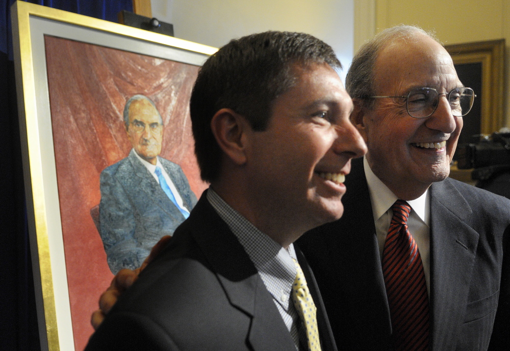 ON DISPLAY: Former US Senator George Mitchell, right, greets Maine House Representatives minority leader Ken Fredette, R-Newport, Tuesday after the unveiling ceremony for Mitchell’s official portrait at the State House in Augusta.