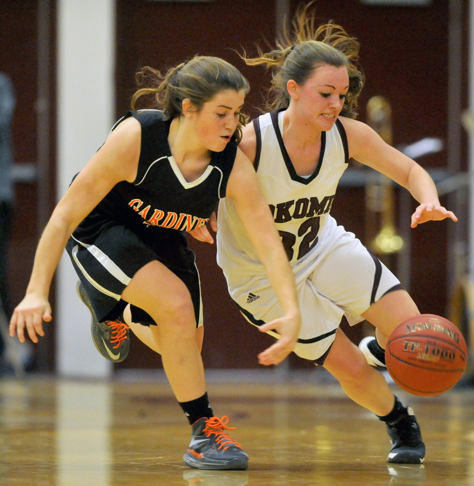 Staff photo by Michael G. Seamans Gardiner High School's Lauren Chadwick, 4, fights for the loose ball with Nokomis High School's Taylor Shaw, 32, in Newport on Wednesday.