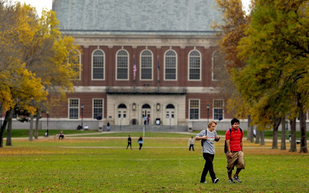 Dmitri Onishchuk, a freshman from Oakdale, N.Y., and Daniel Norwood of Acton, a junior, walk through the mall at the University of Maine, in Orono, on a fall afternoon.