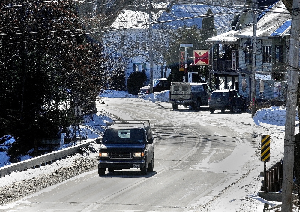 reconstruction coming: A van crosses a bridge over Mill Stream as it heads north out of Belgrade Lakes village on Route 27 on Thursday. The bridge is at the northern end of a propsed .38 mile reconstruction project to the village.