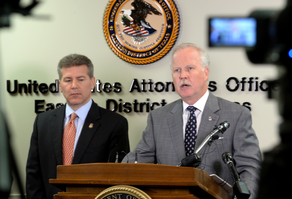 U.S. Attorney John M. Bales, right, and Brian Moskowitz with Homeland Security address media Thursday Jan. 30, 2014, after several raids in Port Arthur and Houston that allegedly involved a large operation of illegal employment in multiple states. Twenty three arrests have been made.