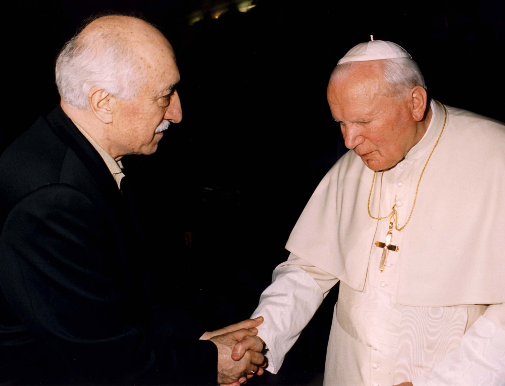 Turkish Muslim spiritual leader Fethullah Gulen shakes hands with Pope John Paul II when they met at the Vatican in 1998. One of the proposed charter schools that moved ahead Thursday would be run by his followers, but is not intended to be a religious school.