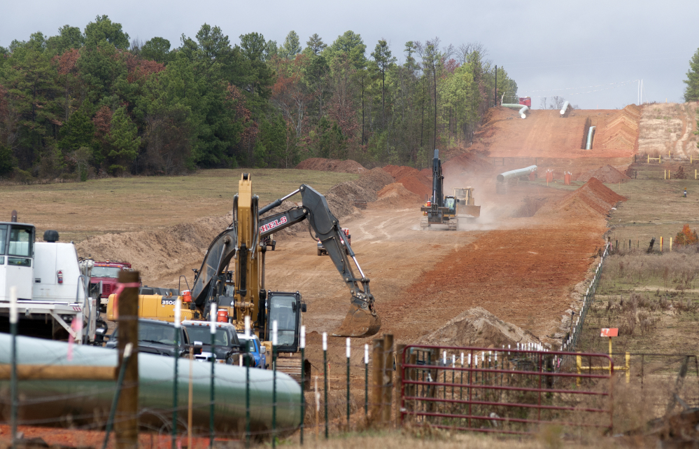 In this Dec. 3, 2012, photo, crews work on construction of the TransCanada Keystone XL Pipeline east of Winona, Texas.