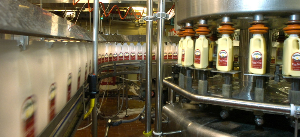 Containers are filled with eggnog on a production line at Oakhurst Dairy on Forest Avenue in Portland. The company employs 200 workers.
