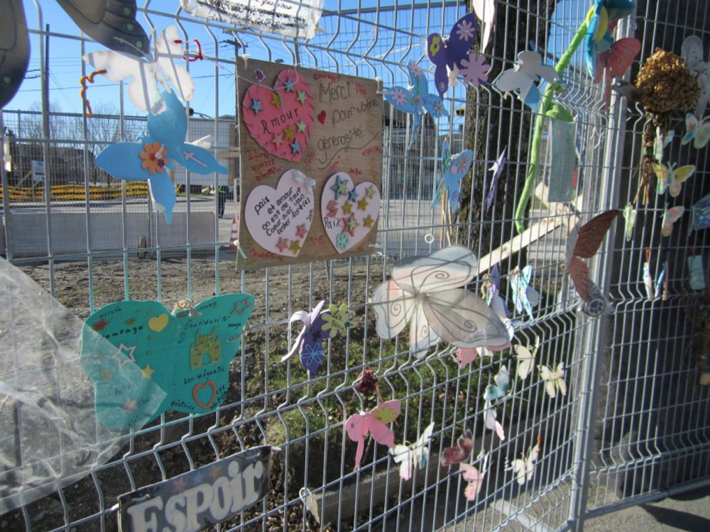 Tributes shaped like butterflies and hearts decorate a fence in November in Lac-Megantic, Quebec. The items were placed there in honor of some of the 47 people killed last July 6 when a runaway Montreal, Maine & Atlantic Railway train derailed and exploded.