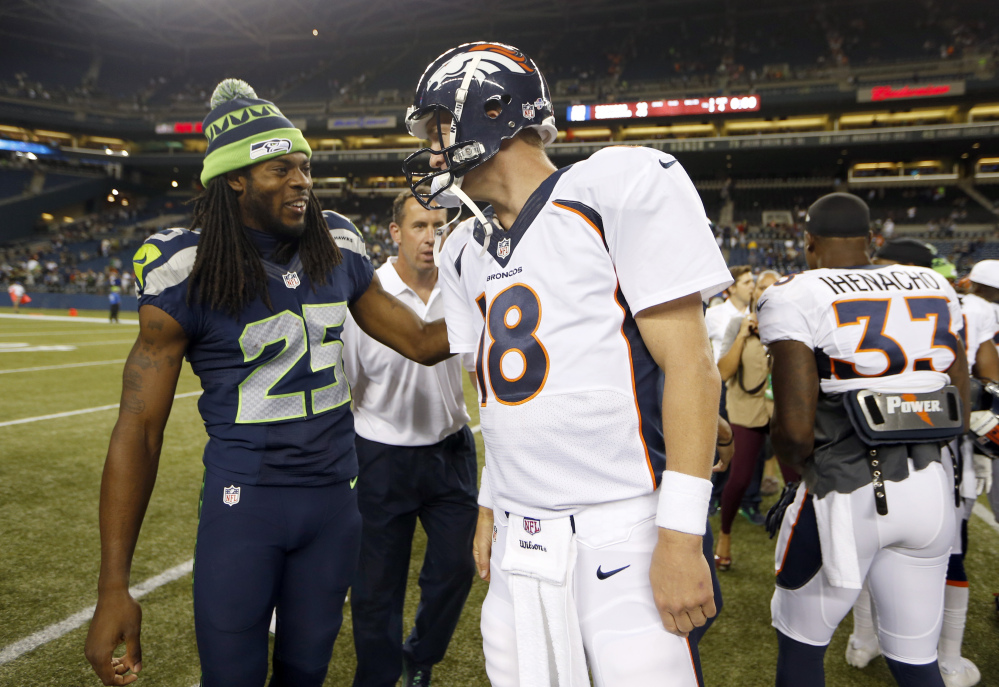 SHOWDOWN: Richard Sherman, left, and the Seattle Seahawks take on Peyton Manning and the Denver Broncos in Super Bowl XLIII on Sunday in E. Rutherford, N.J.