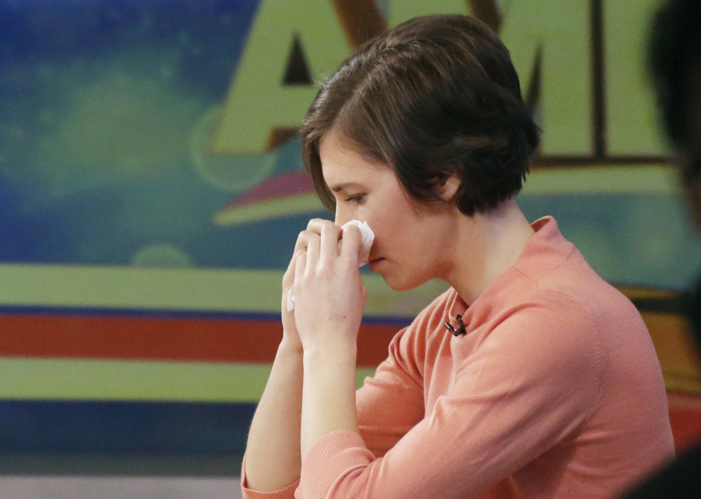 Amanda Knox wipes her nose with a tissue while making an appearance Friday on ABC’s “Good Morning America.”
