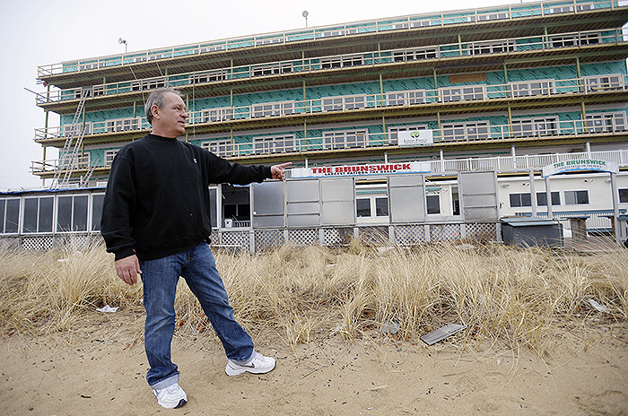 Tom Lacasse, manager of the bar, restaurant and patio at The Brunswick in Old Orchard Beach, stands outside the waterfront business. He worries that new flood maps could hurt the business by causing a steep increase in flood insurance premiums.