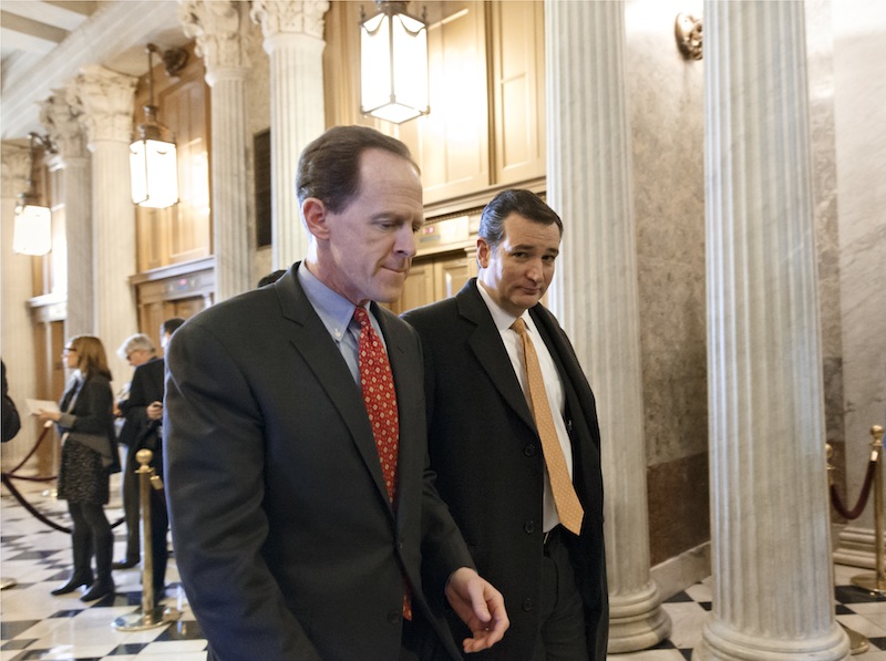 Sen. Pat Toomey, R-Pa., left, and Sen. Ted Cruz, R-Texas, right, arrive at the Senate on Capitol Hill in Washington, Tuesday, Jan. 7, 2014, for a procedural vote on legislation to renew jobless benefits for the long-term unemployed. The vote was 60-37 to limit debate on the legislation, with a half-dozen Republicans siding with the Democrats on the test vote.