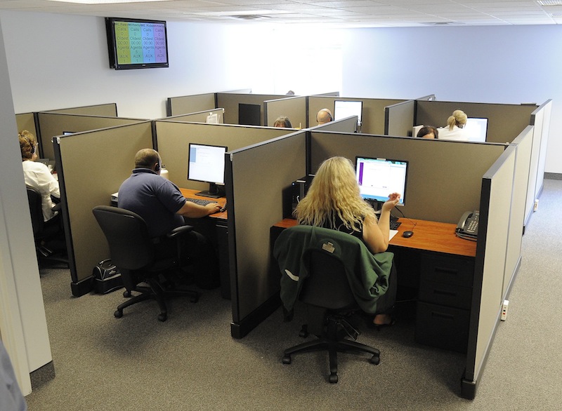 In this August 2013 file photo, a call center in Kennebunk. Labor unions are urging Maine lawmakers to deny taxpayer-funded incentives to businesses that move their call center operations overseas. LogistiCare