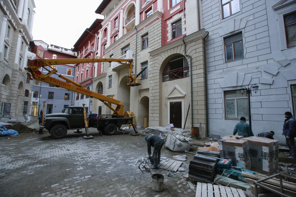 Workers put the finishing touch on accommodation for the Sochi 2014 Winter Olympics on Saturday in Krasnaya Polyana, Russia. According to the Sochi Olympic organizing committee, only six of the nine media hotels in the mountain area are fully operational. The accommodation for athletes, however, has not been affected.
