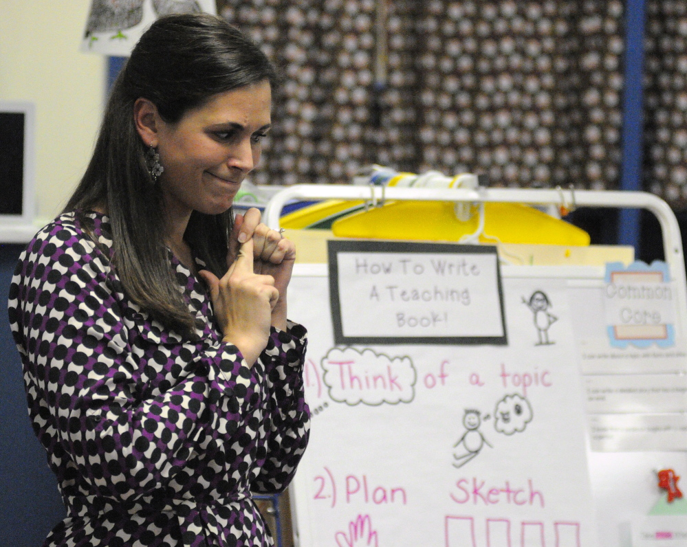 Jessica Gurney talks to her students before they start a writing workshop last fall at Manchester Elementary School.