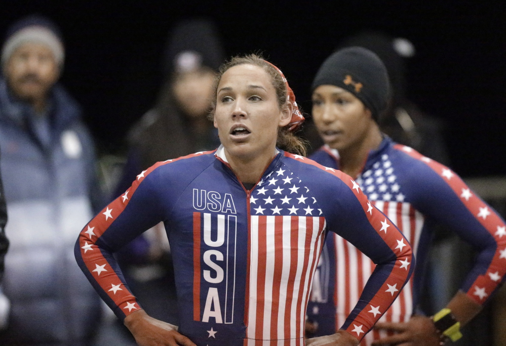 In this Oct. 25, 2013, photo, Jazmine Fenlator, right, and Lolo Jones catch their breath after a heat in the U.S. women’s bobsled team Olympic trials in Park City, Utah. Jones is one of three athletes picked to push sleds in Sochi. The U.S. Bobsled and Skeleton Federation has gotten a number of complaints suggesting that it chose Jones because of her popularity.