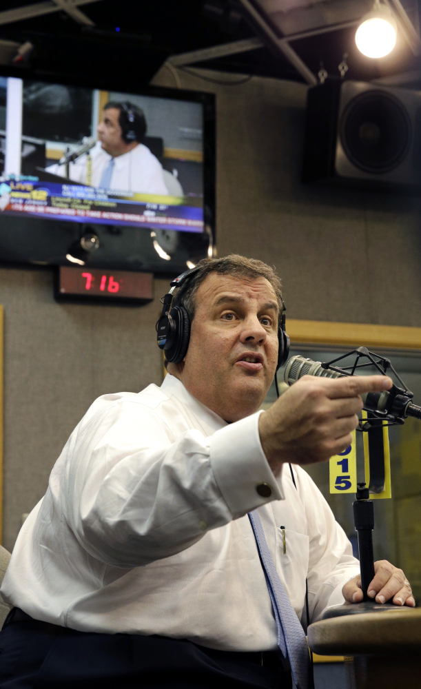New Jersey Gov. Chris Christie talks to a listener during an "Ask the Governor" broadcast at a Ewing, N.J., radio station Monday. During the program, Christie took questions from callers for the first time in more than three weeks as his campaign looked for a way to pay for lawyers as a political payback scandal continues.