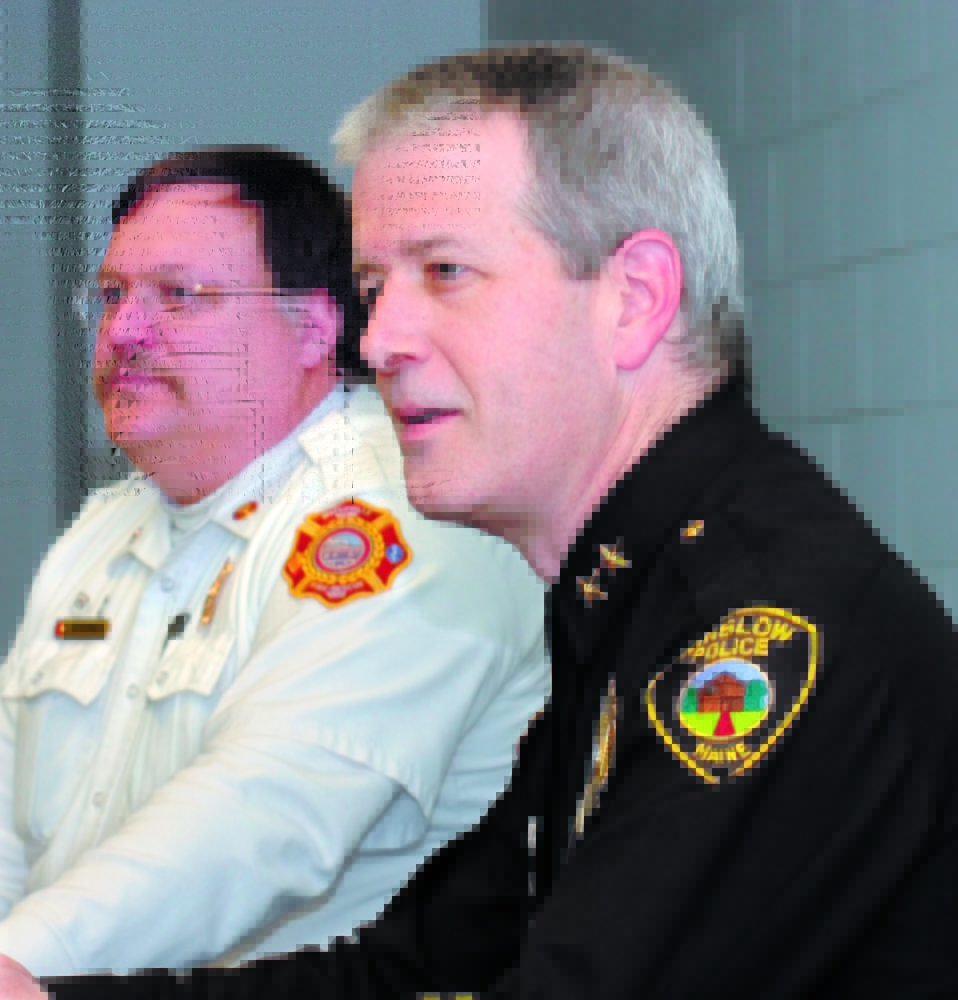 FORMER CHIEF: Jeffrey Fenlason, right, of the Winslow Police Department, attends a meeting in 2009 with other town officials shortly before he was named the town’s police chief that year.