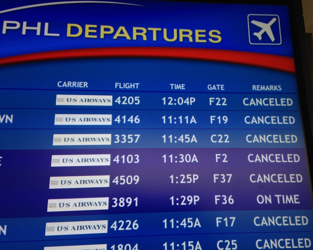 The departure board at the Philadelphia International Airport shows canceled flights on Monday.