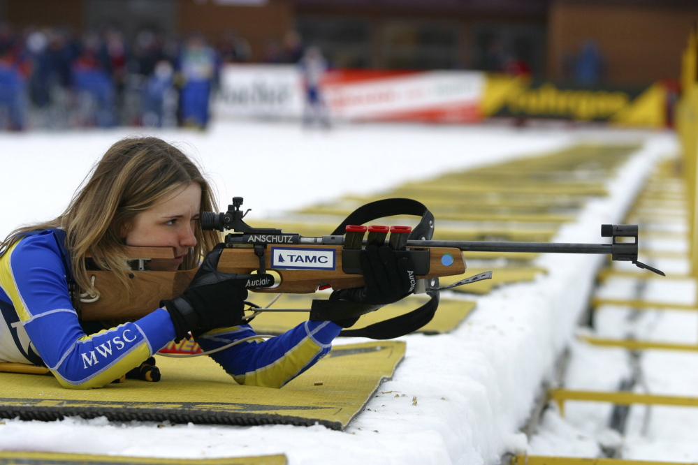 Wearing a Maine Winter Sports Center jersey, Meagan Toussaint of Madawaska takes aim with a rifle designed for use in the biathlon.
