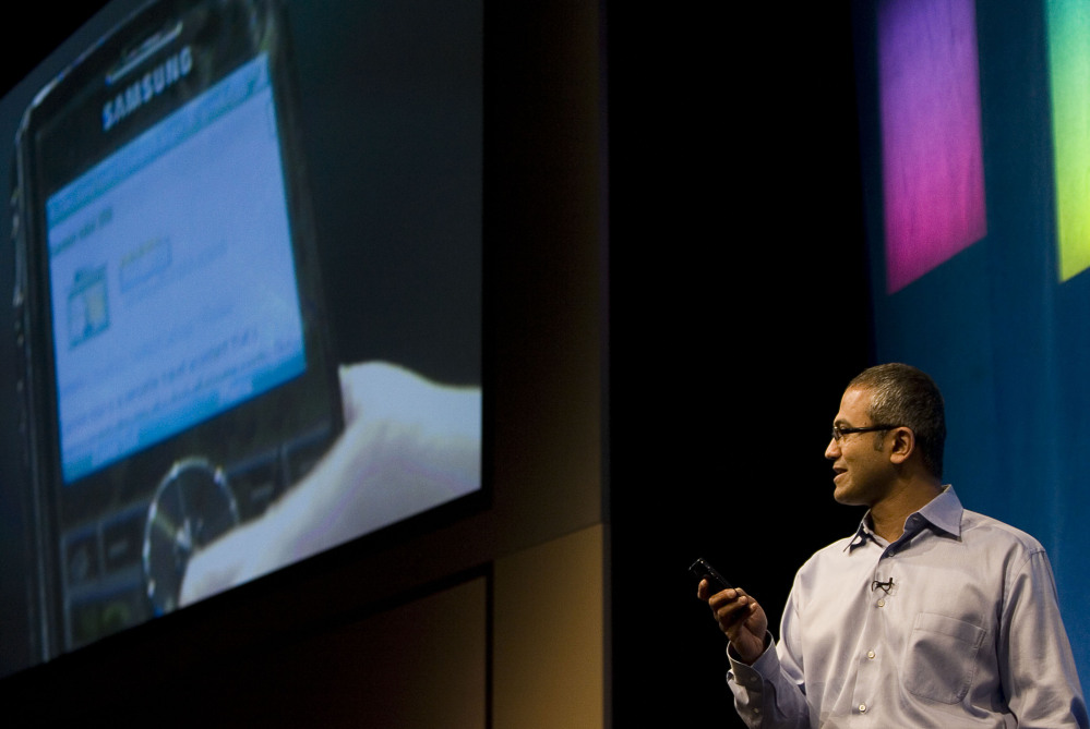 Satya Nadella demonstrates some of the features of Live Search on a mobile device at the company’s campus in Redmond, Wash.