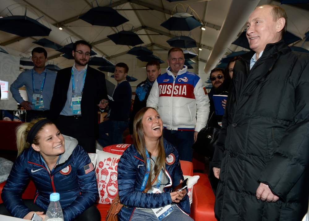 Russian President Vladimir Putin meets with athletes from the United States while visiting the Athletes Village in the Coastal Cluster ahead of the Sochi 2014 Winter Olympics on Wednesday.