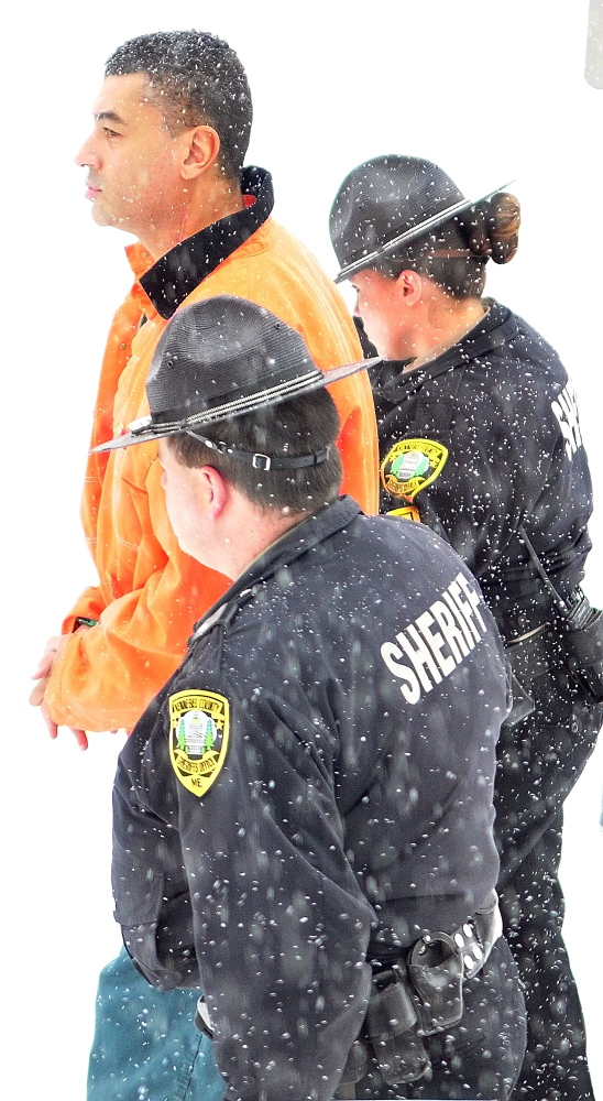Justin G. Pillsbury walks with Kennebec County deputies this morning out of Kennebec County Superior Court after a hearing where he pleaded not guilty to the charge of murdering his girlfriend and roommate Jillian Jones in their Augusta apartment last November.