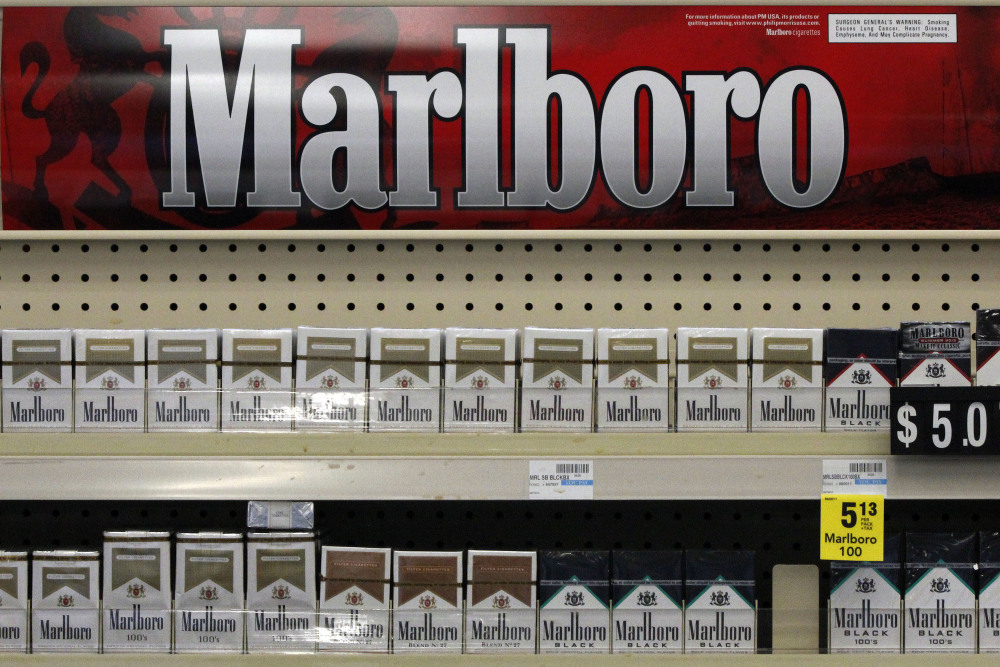Marlboro cigarettes are on display in a CVS store in Pittsburgh. The move to phase out cigarettes, cigars and chewing tobacco by Oct. 1 will cost the nation’s second-largest drugstore chain about $2 billion in annual revenue.