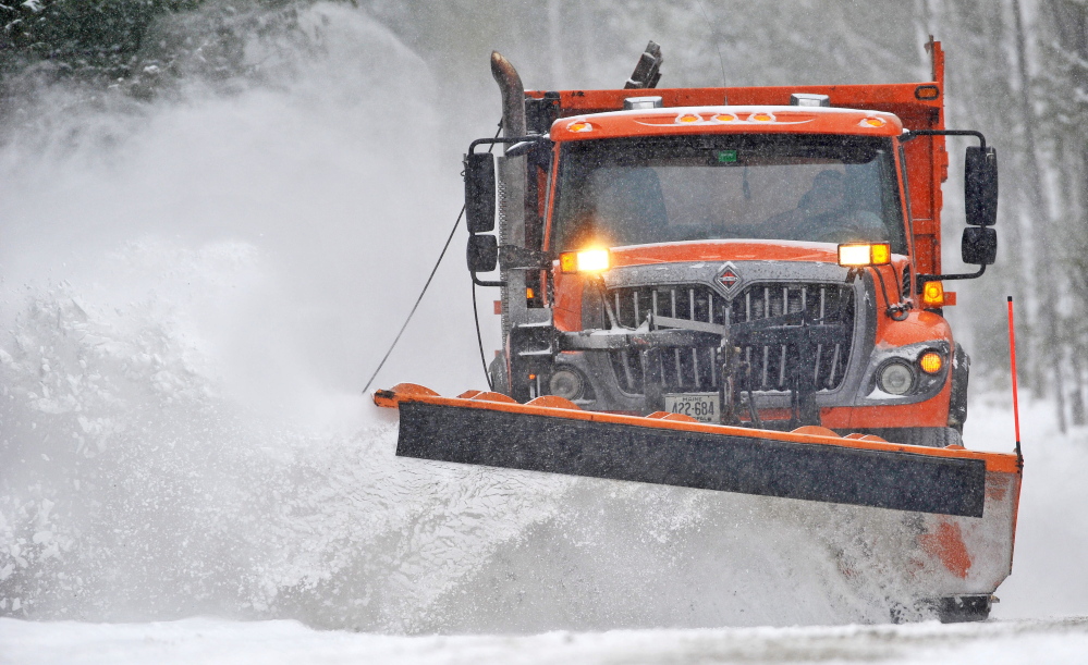 POW PLOW: A plow with the Waterville Public Works clears fresh snow from Quarry Road as a major storm moves through central Maine on Wednesday.